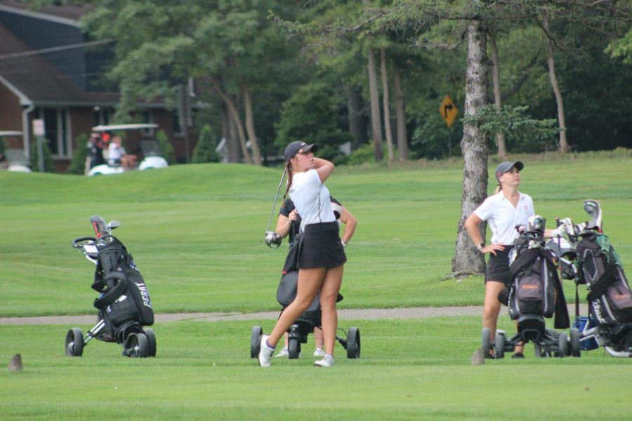 Senior Halle Ellis tees off against Perry Aug. 23. The Vikings defeated the Panthers 163-240.