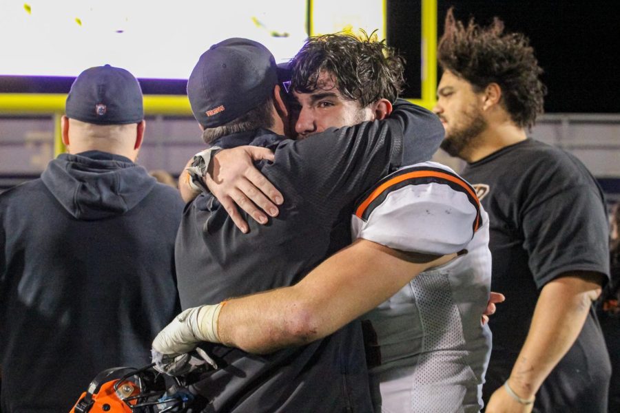Coach Nettleton and senior Luke Griguolo [linebacker] share tears as Lukes football career at Hoover High School comes to an end.