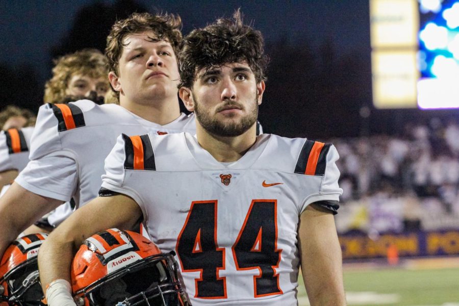 Senior Luke Griguolo [linebacker] stands in honor of the National Anthem Oct. 21 at Jackson High School.