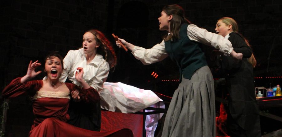 Senior Livi Pedone, junior AnnaSophia Bates and sophomores Emma Schenk and Kylan Solida perform in the November 2022 production of Dracula