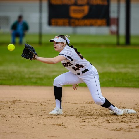 Junior Sadie Carroll receives a throw during the conference game against the Lake Blue Streaks at home April 4. Photography: Mr. Tim McCarty/Used with permission