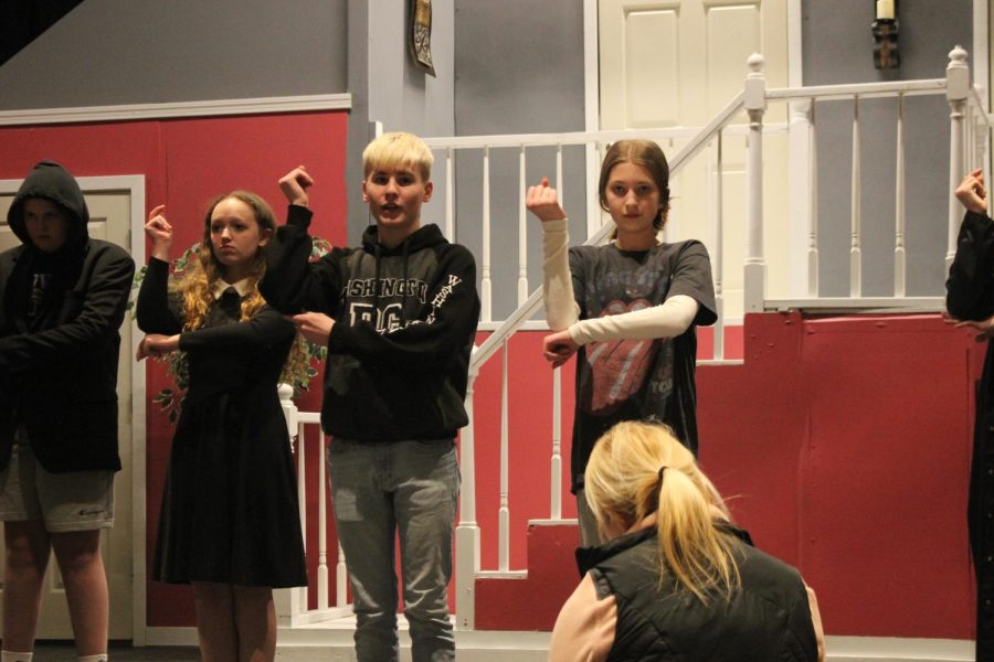 [from left] Hoover Sophomore Emma Schenck, GlenOak freshman Zach May, and NCMS seventh grader Elle Tamulewicz rehearse The Addams Family.