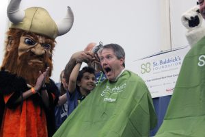 Dave Pilati shaving his head for St. Baldricks 2023 fundraiser.