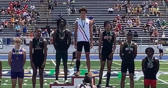 Isaiah Barker winning the 2024 long jump.