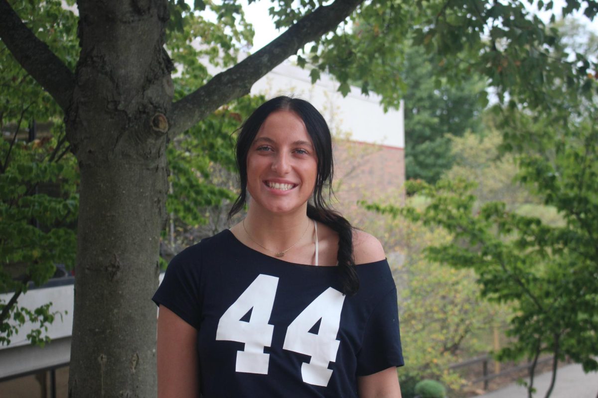 Senior Sydni Wyant posing for headshot