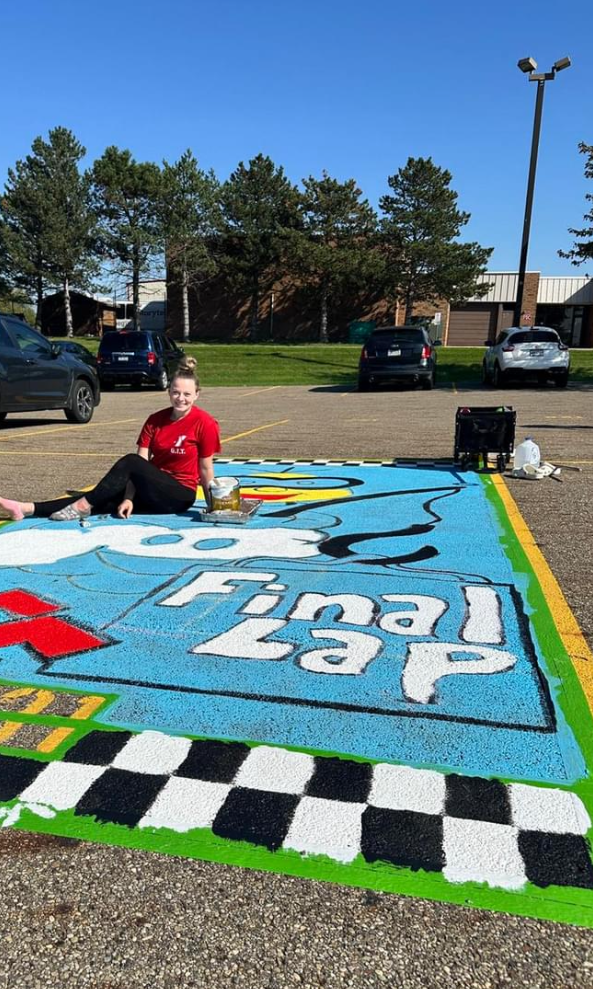 Hoover student painting her parking spot.