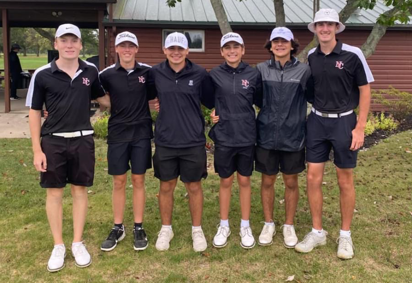 The varsity boys golf team gets a group picture after a match. 