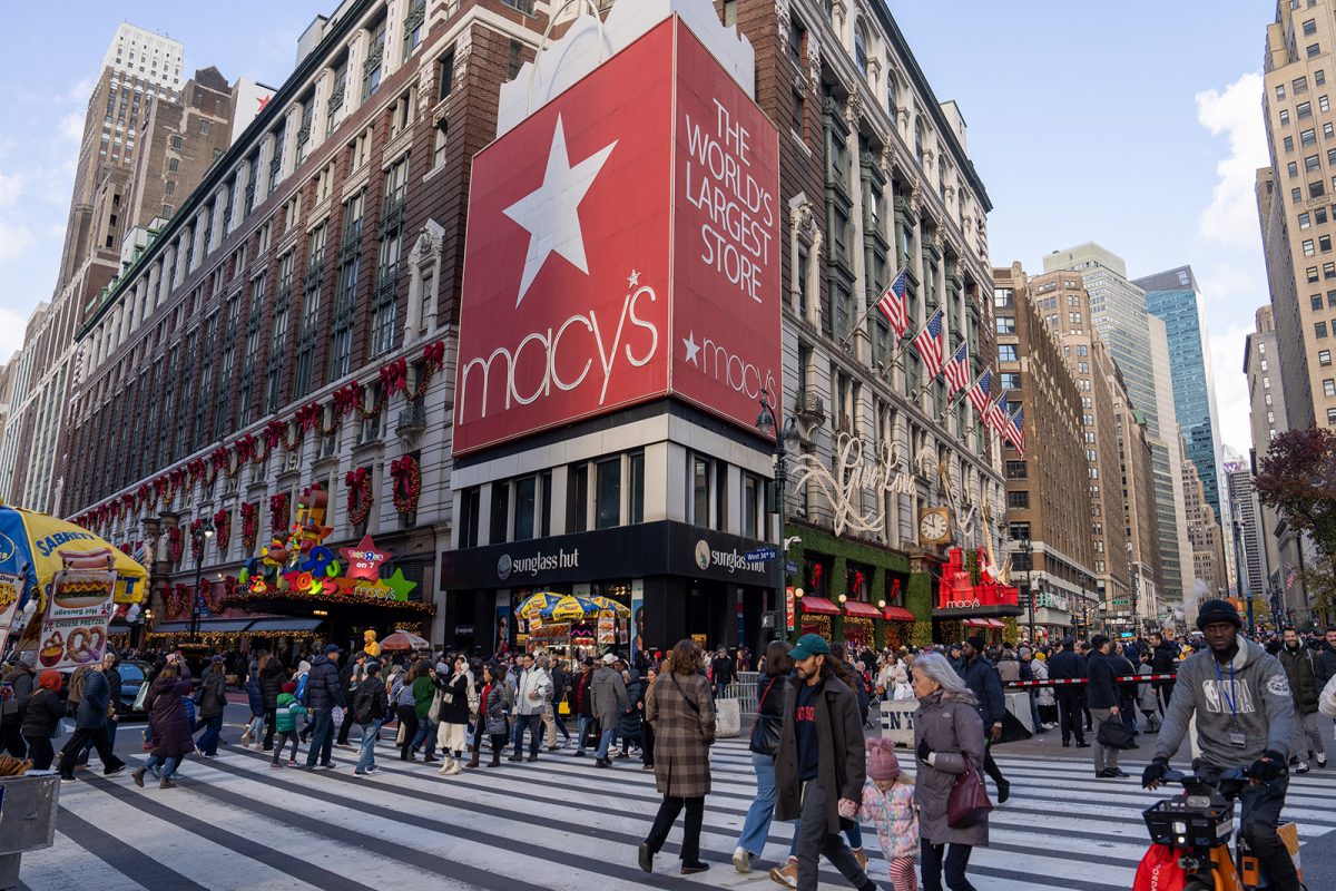 People walk past the Macy's Herald Square flagship store on Nov. 29, 2024, in New York. Black Friday sales will give economists a glimpse into consumers' holiday shopping mood. 