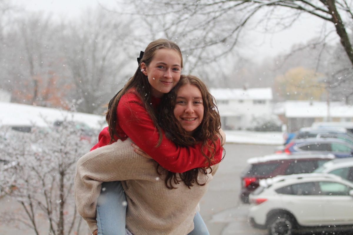 Julia Frantz and Carys Eynon posing for a picture outside of Hoover High School