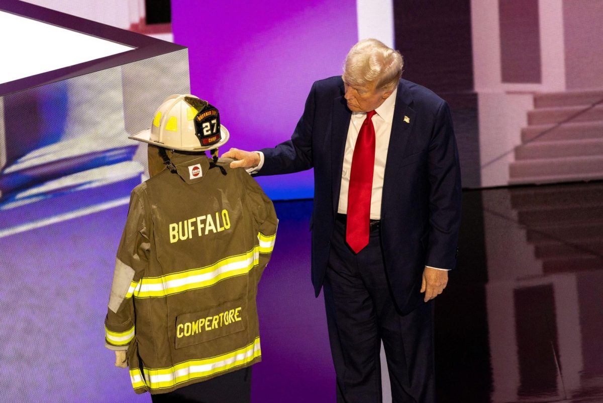 Former President Donald Trump touches the coat and helmet 
of former firefighter Corey Comperatore, who was fatally shot during the attempted assassination of the former president. Trump accepted the Republican nomination for 
president Thursday, July 18, 2024, at the Republican National Commission that included his recounting of the attack Saturday at a rally in Pennsylvania.