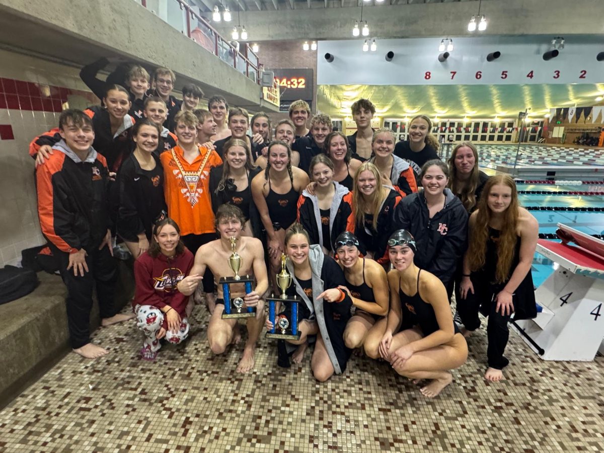  Hoover swim team celebrates with after winning the McKinley Relays Dec. 4. 