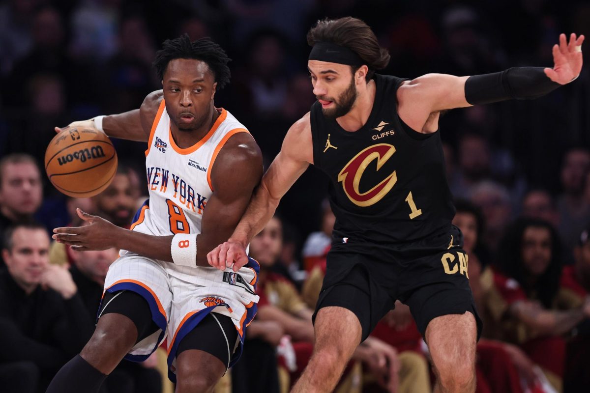 The New York Knicks’ OG Anunoby (8) is defended by the Cleveland Cavaliers’ Max Strus (1) during the first 
quarter at Madison Square Garden on Friday, April 11, 2025, in New York