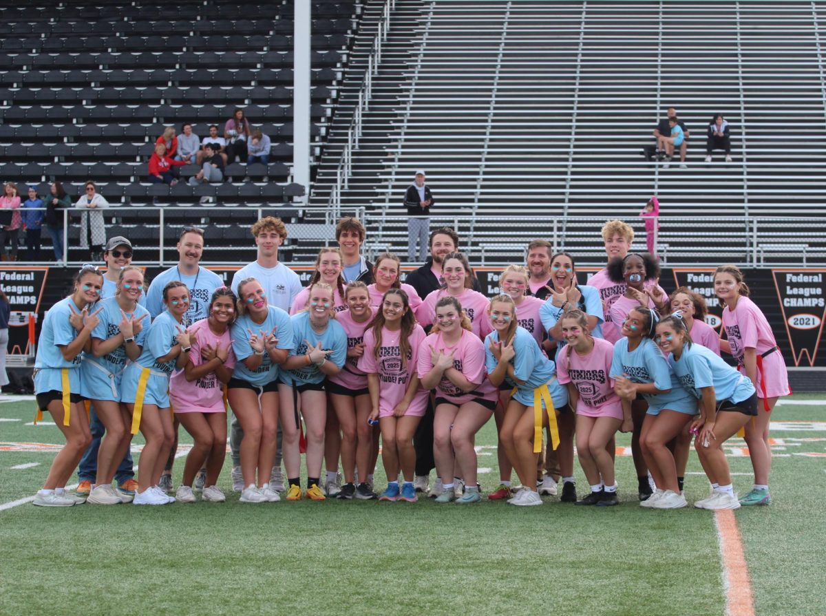 Both Powderpuff teams take a group photo after the juniors won the game with a final score of 14-0. 