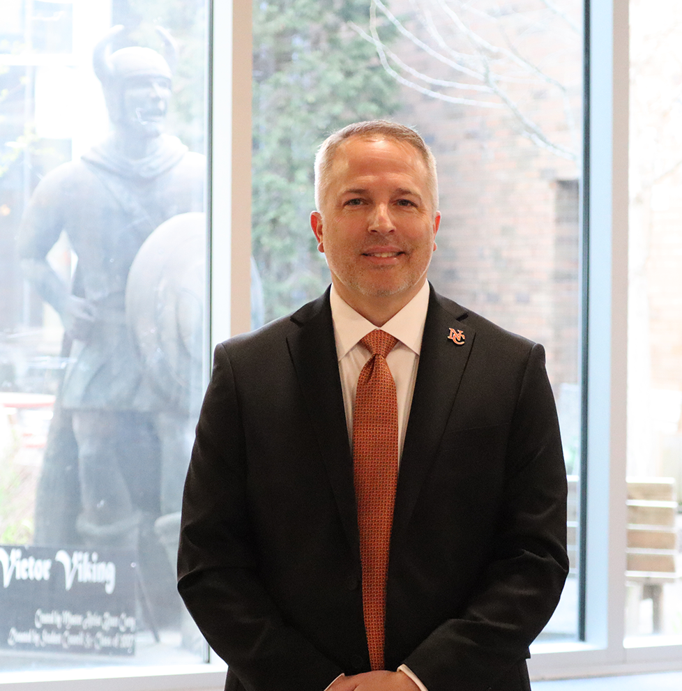 NCCS Treasurer Mr. Tim Walker poses for a photo in front of the courtyard 
at Hoover High School. Mr. Walker will be Superintendent beginning July 
1