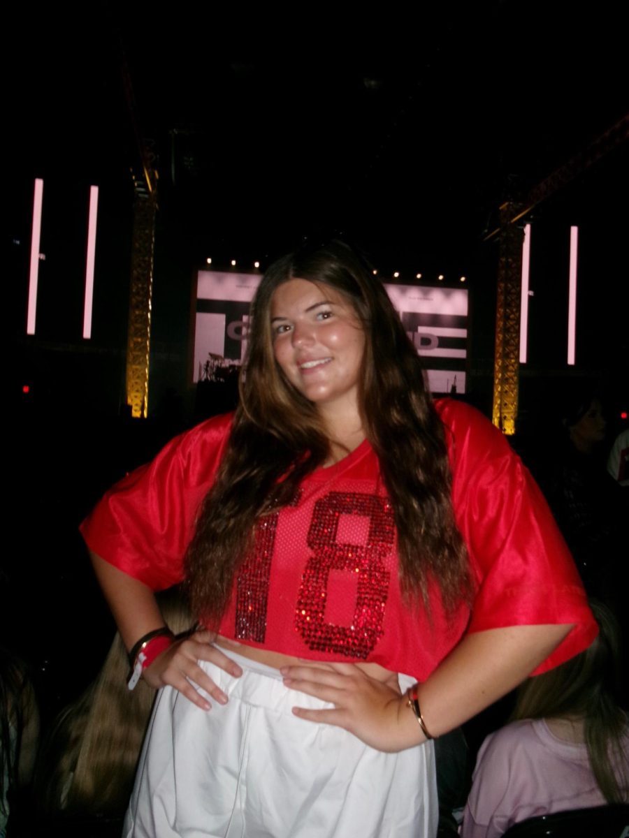 Senior Claire Vandervaart smiles for the camera as she attends the Tate McRae 
concert.