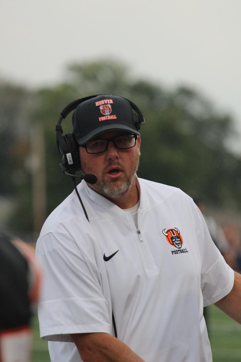 Hoover varsity football coach Brian Baum directs his team during the game against Akron North Sept. 5. Baum won his 100th career win the previous week against Medina