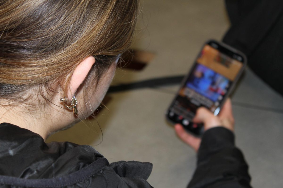 Hoover senior Avalyn Edgell scrolls on TikTok amid the ongoing 2016 nostalgia trend.